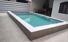 Casa piscina com ozônio churrasqueira perto da praia